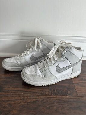 Nike White High-Top Sneakers with Silver Glitter Swoosh